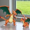 Mô hình Mega Charizard Y Pokémon màu cam, tung đôi cánh xanh và ngọn lửa ở đuôi