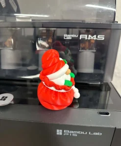 Ông già Noel trong túi quà in 3D góc nhìn bên