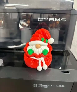 Ông già Noel mini trong túi quà đỏ in 3D nhìn chính diện